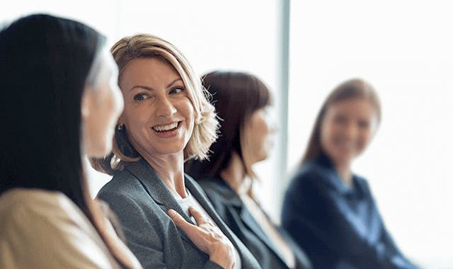 woman laughing with friends