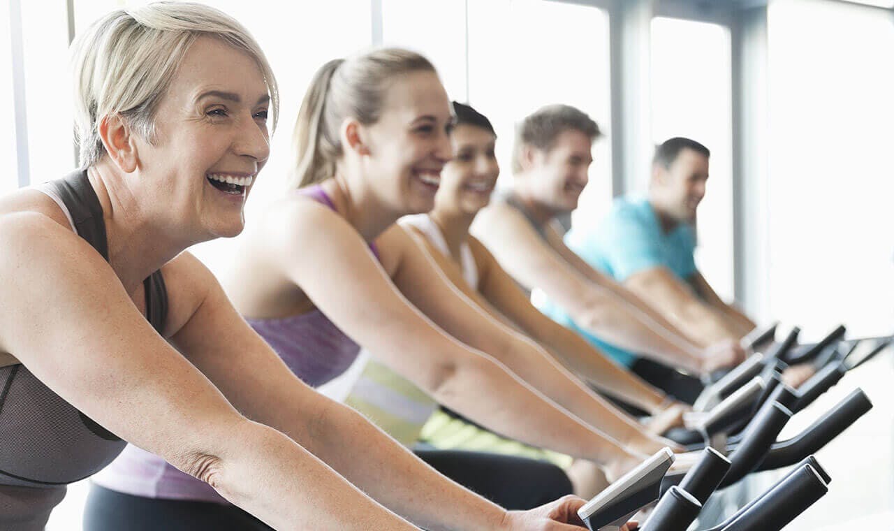 woman exercising with friends