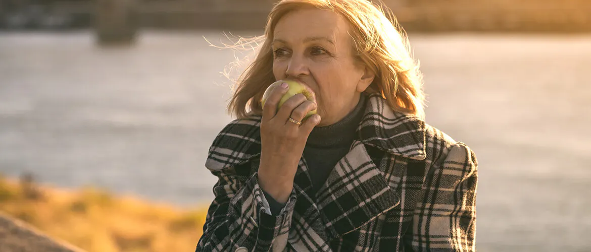 Woman eating an apple