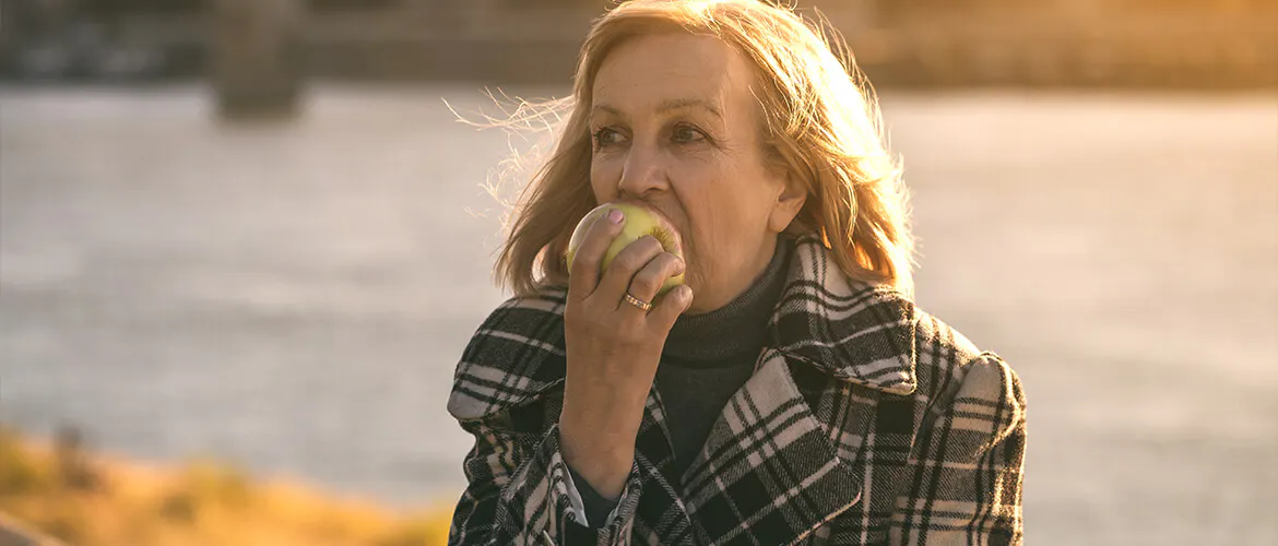 Woman eating an apple