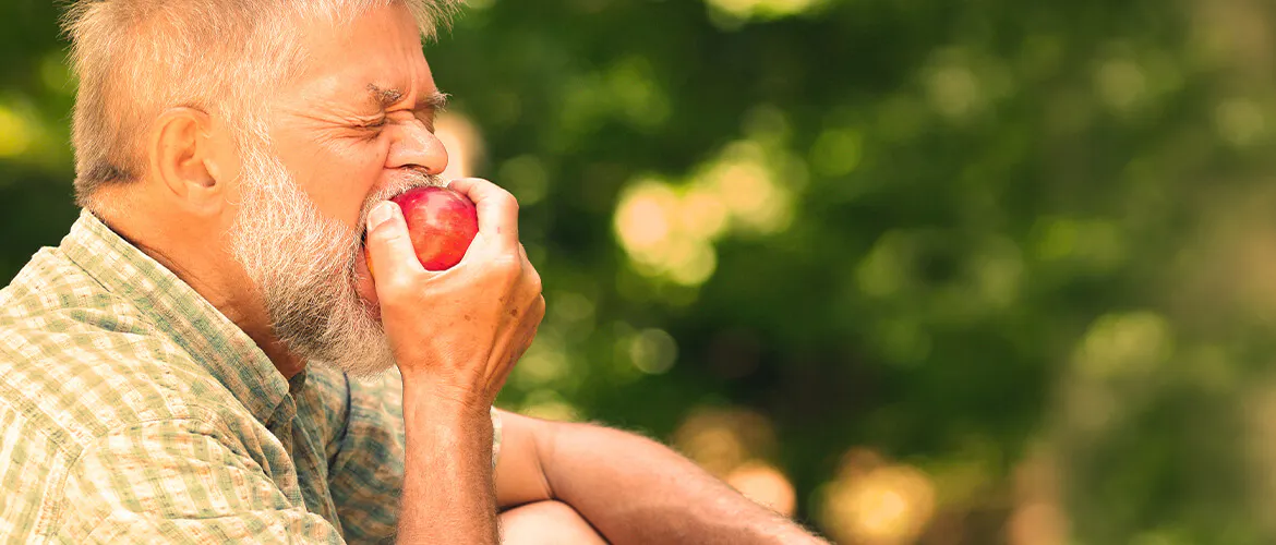 Man eating an apple