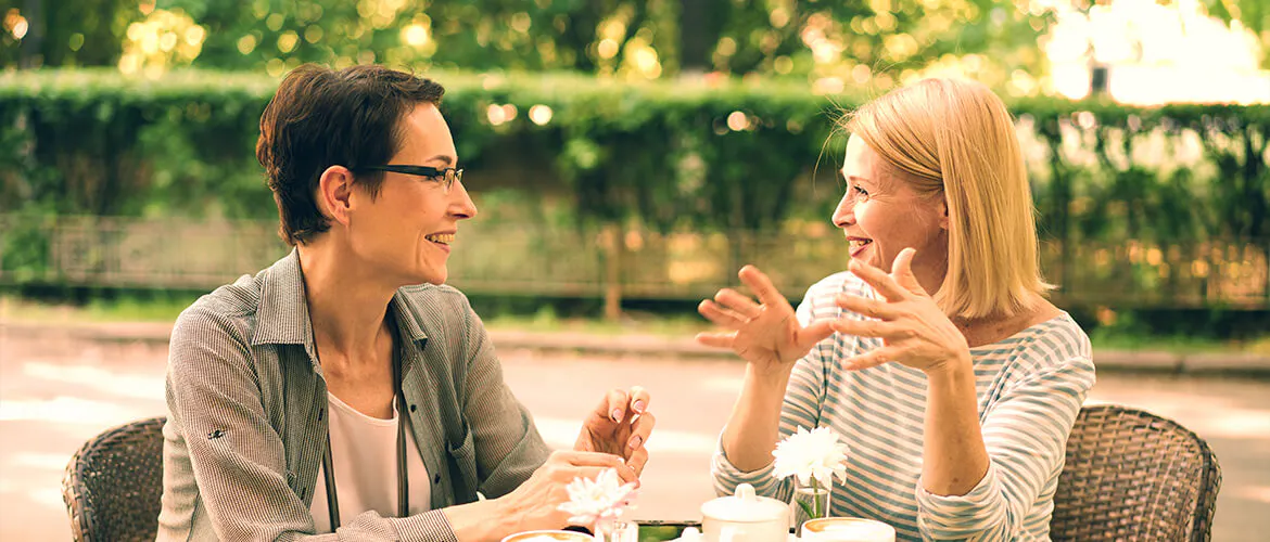 Two woman talking in a cafe