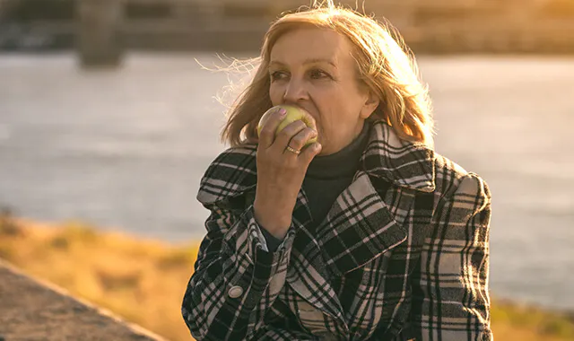 Woman eating an apple