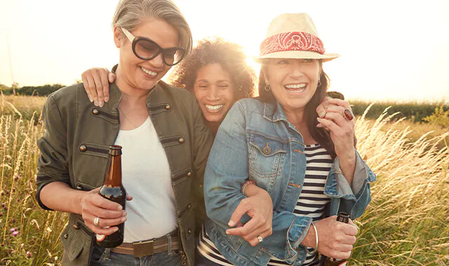 Three women laughing
