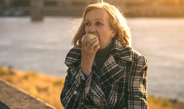 Woman eating an apple
