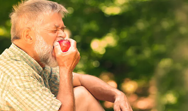 Man eating an apple