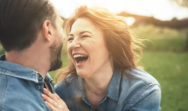 Woman and man laughing