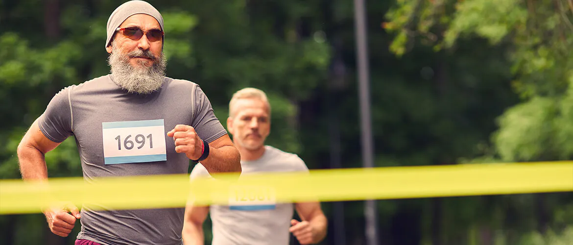 Men running, arriving at the finish line
