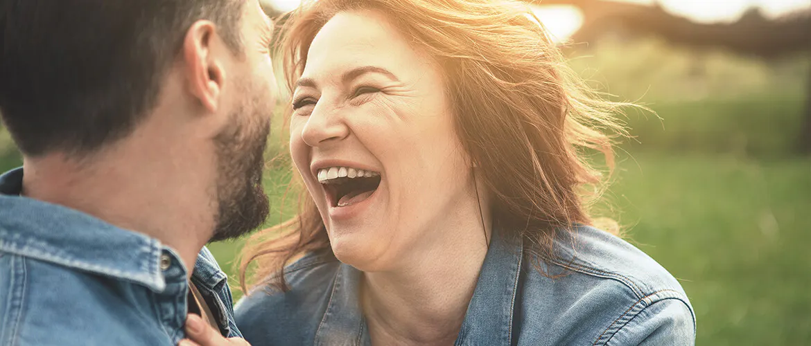 Woman and man laughing