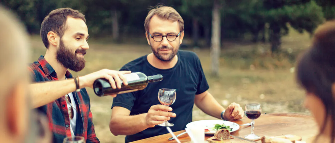 Friends drinking wine outdoors