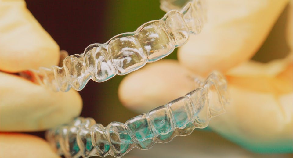 A set of top and bottom clear dental retainers