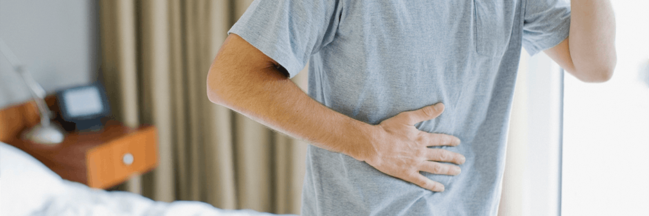 Man Holding Stomach Header