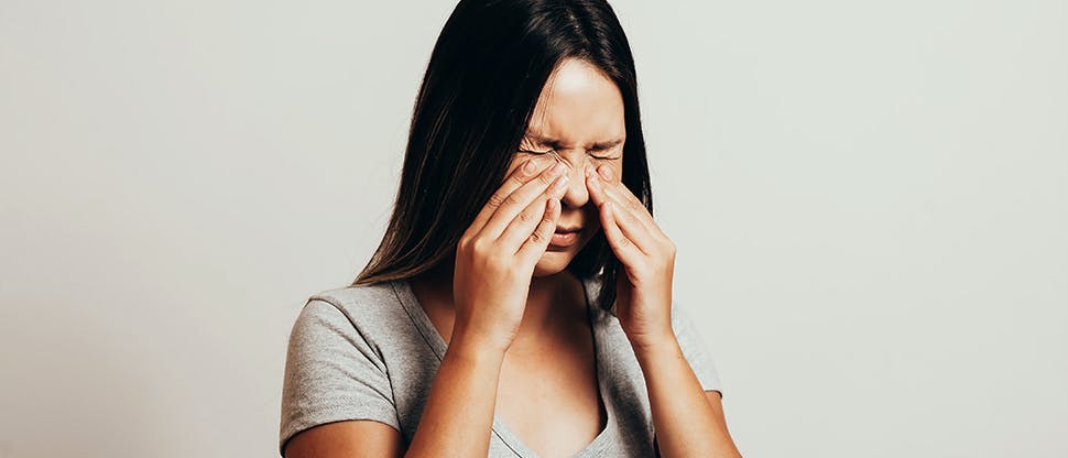 Woman suffering pain from sinusitis