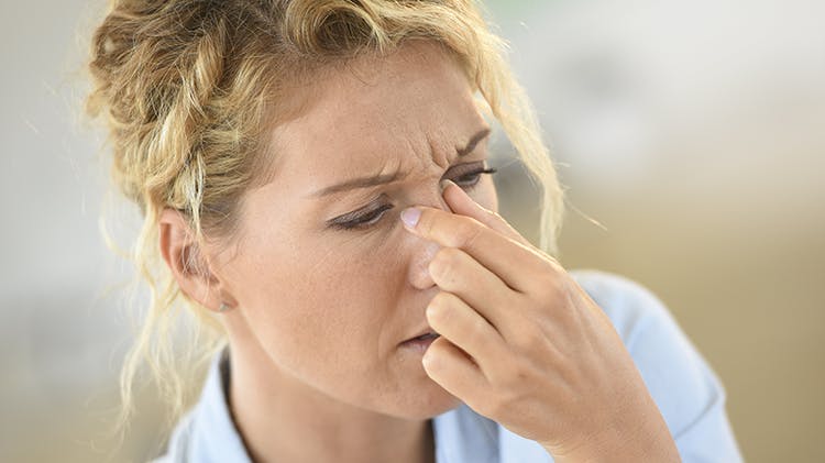 Woman suffering sinus pressure