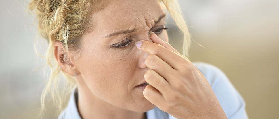 Woman suffering sinus pressure
