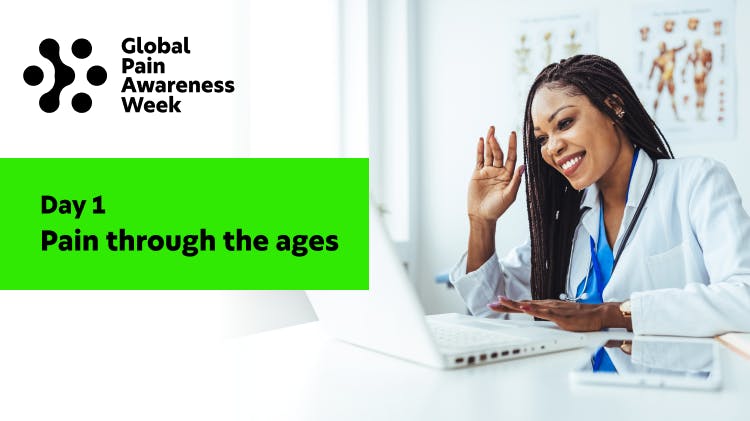 Female doctor working at laptop in hospital office, on a video conference call. 