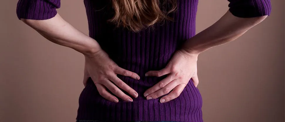 A middle-women suffering from low back pain