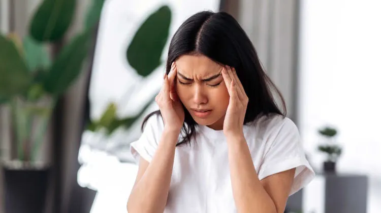 Patient struggling with a migraine 