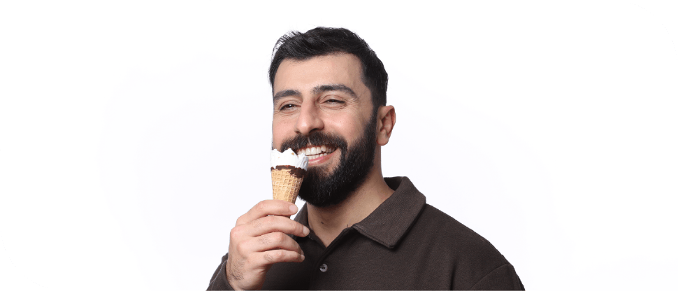 Happy arab male eating ice cream