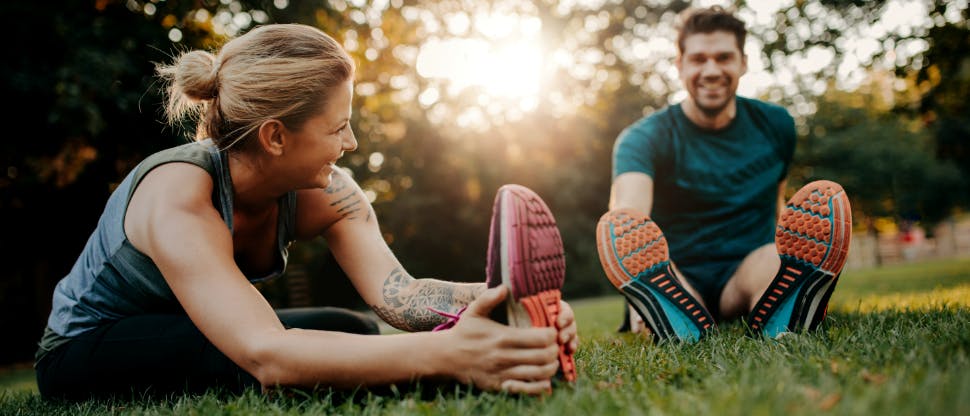 Man and woman exercising outdoors