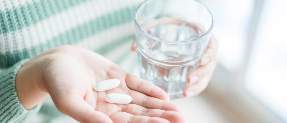 Tablet and glass of water