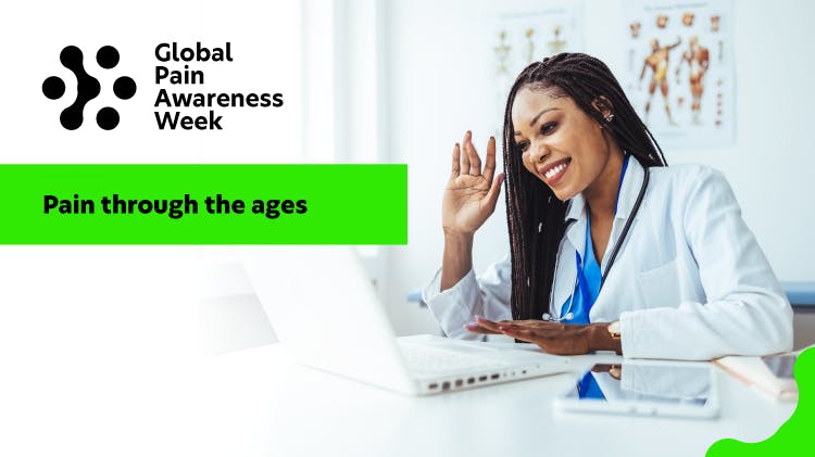 Female doctor working at laptop in hospital office, on a video conference call. 