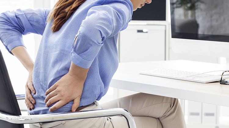 Business women with back pain