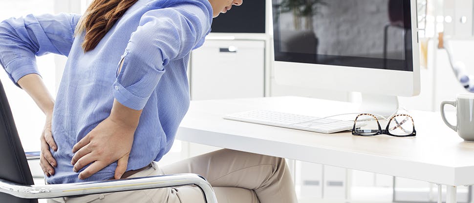 Business woman with acute back pain