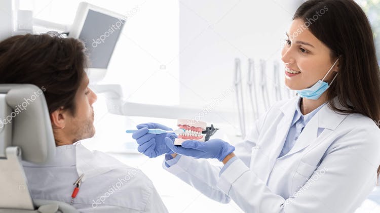 Image of dentist and patient 
