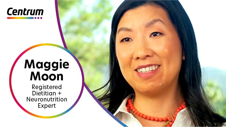 World Pharmacist Day title in Centrum Bottle in rainbow spectrum outline and has Centrum logo at the top of the bottle. To the right of the bottle is a photograph of Maggie Moon, registered dietitian and neuronutrition expert.