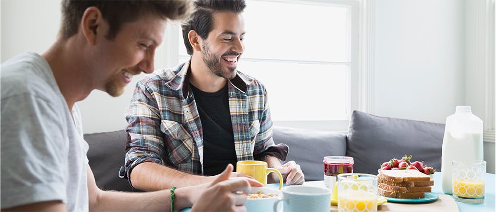 Two men eating breakfast