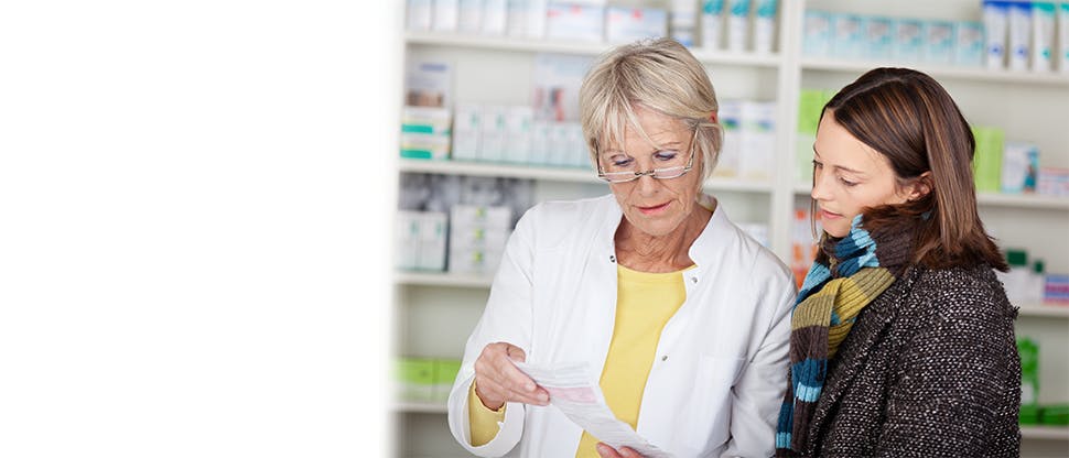 142851301 Pharmacist discussing cold & flu with patient