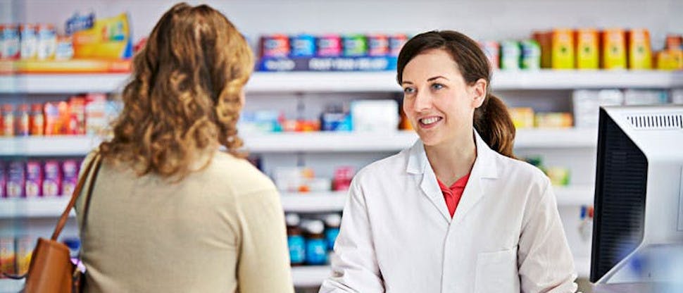 Pharmacist with patient