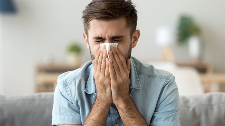 Patient blowing nose