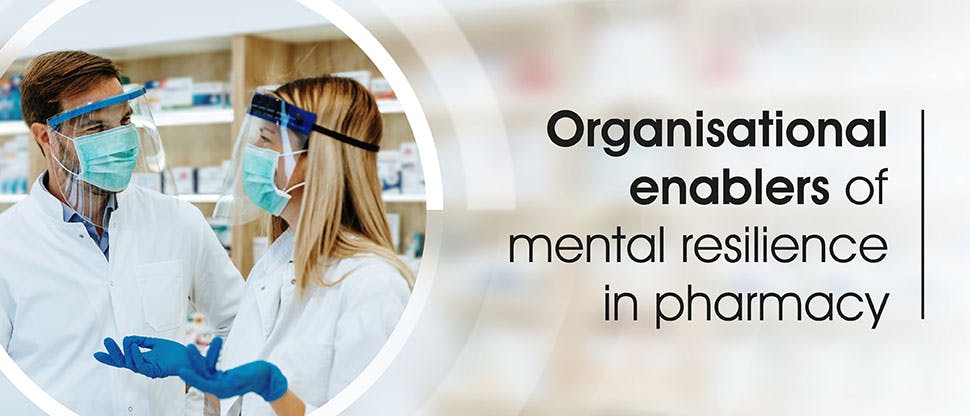 EXPERT_Mental Resilience_GHP Article_Header_Organisational enablers Two pharmacists wearing protective medical apparel to help protect themselves against COVID-19.