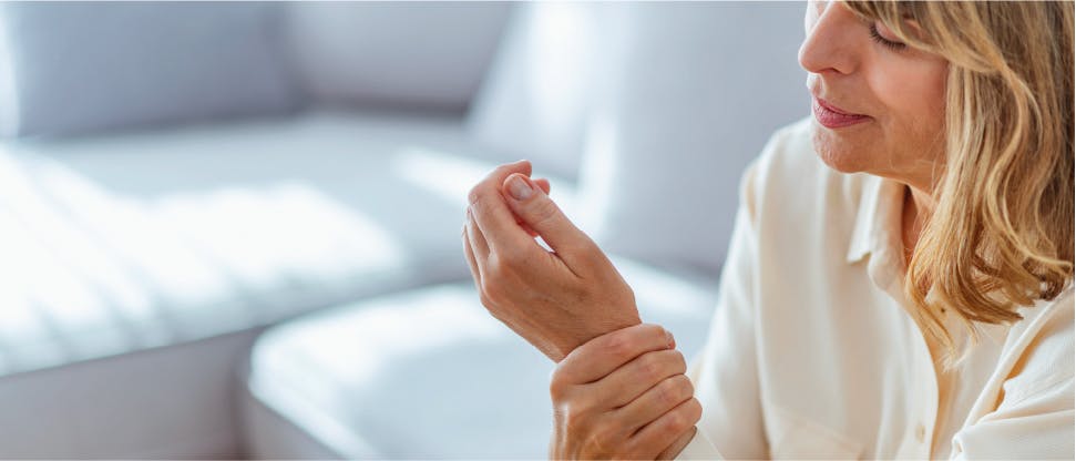 Woman holding wrist