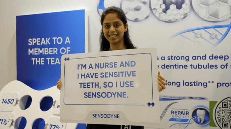 Images of dental professionals holding signs saying that they have sensitive teeth and use Sensodyne.