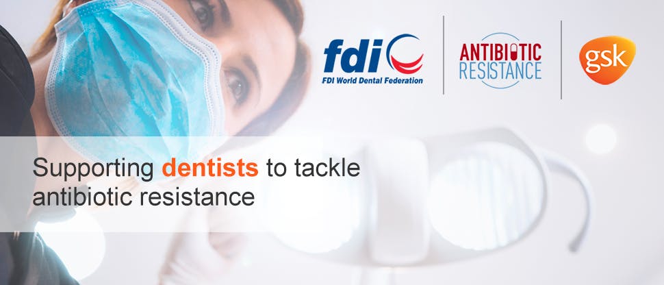 Dentist wearing face mask with FDI logo graphic