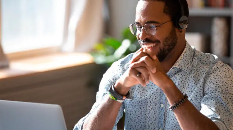 Man smiling at desk