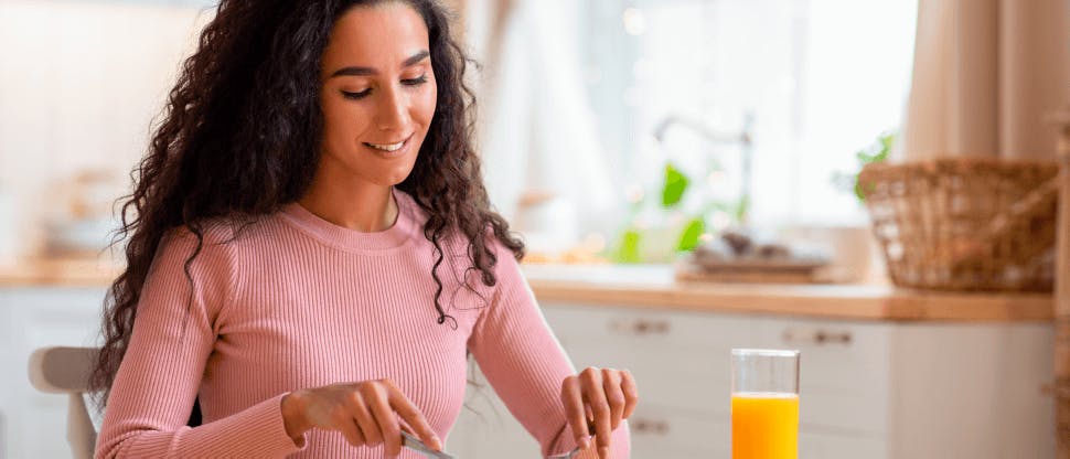 Image of a woman eating a healthy meal