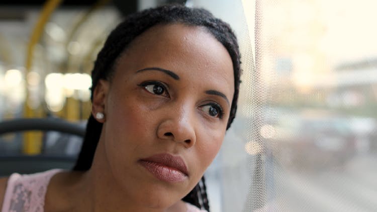 Patient reflects whilst looking out of window.