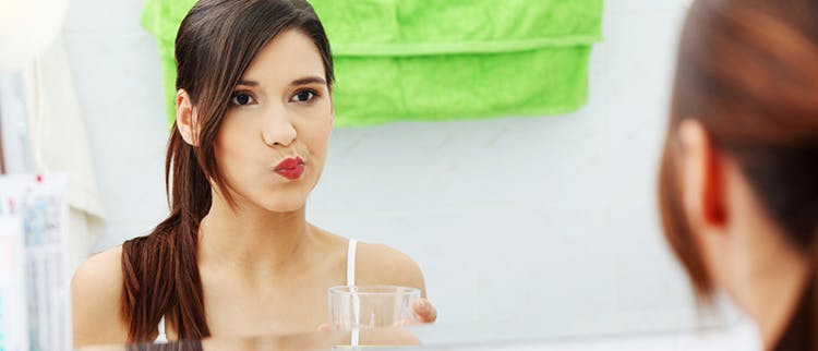 Woman rinsing
