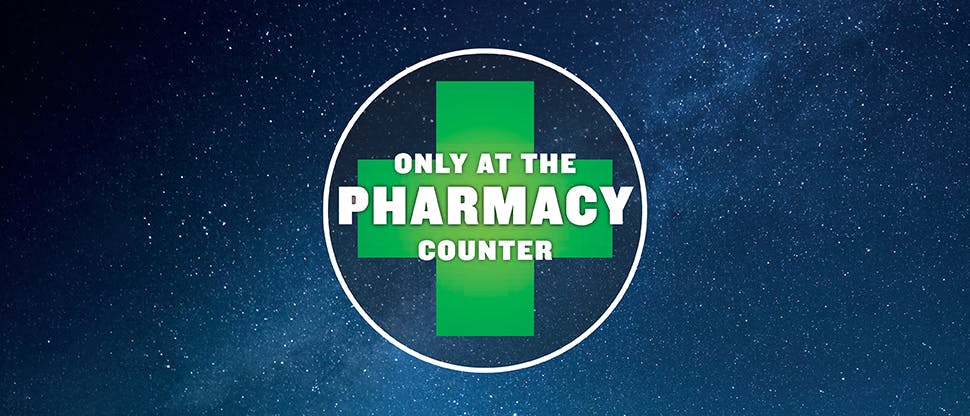 “only at the pharmacy counter” written in green cross on a night sky background
