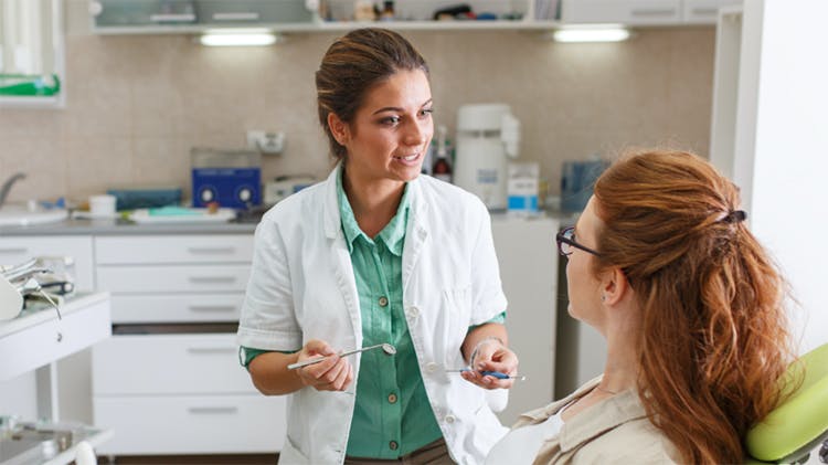 Patient talking to a dentist