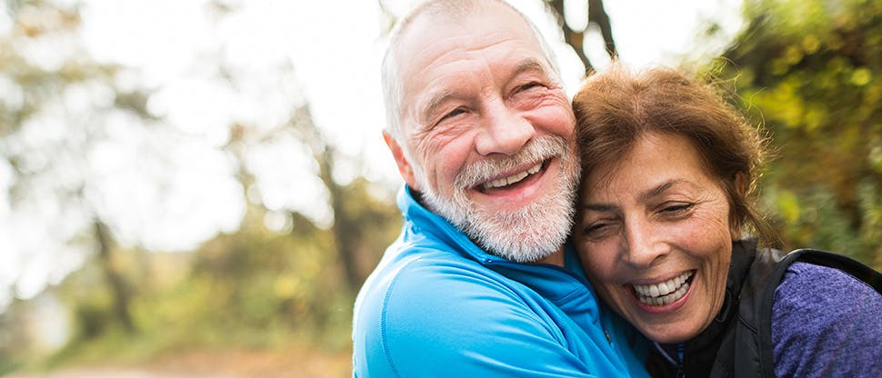 Couple smiling together outside