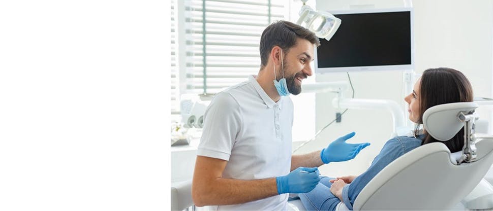 Dentist discussing with patient
