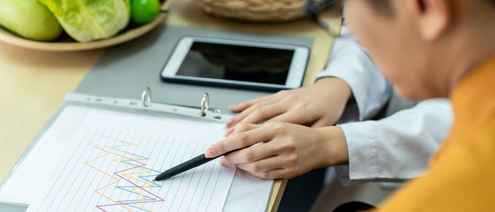 Scientists assessing a graph