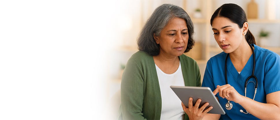 A female doctor gives advice to a senior female patient.