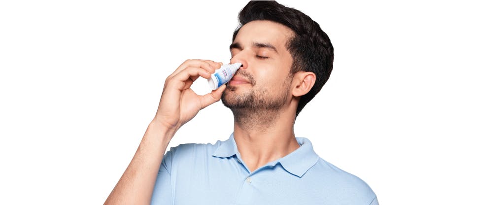 Man using nasal spray