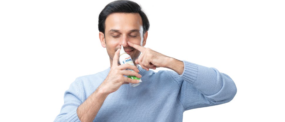 Man with nasal spray